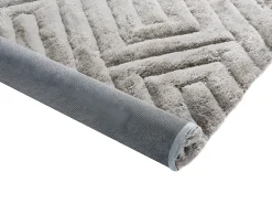 Conjunto mesa de centro con tablero pivotante transparente JOLINE y alfombra shaggy gris MAZE