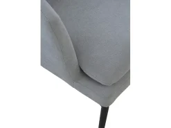 Sillón tapizado color gris perla con cojín y patas de metal negras