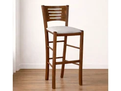Taburete Verona en madera de nogal oscuro, altura 73 cm, con asiento acolchado gris claro.